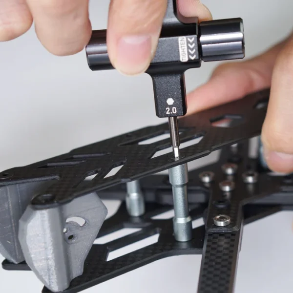 STP prop tool using the 2.0 mm hex driver on an FPV frame screw